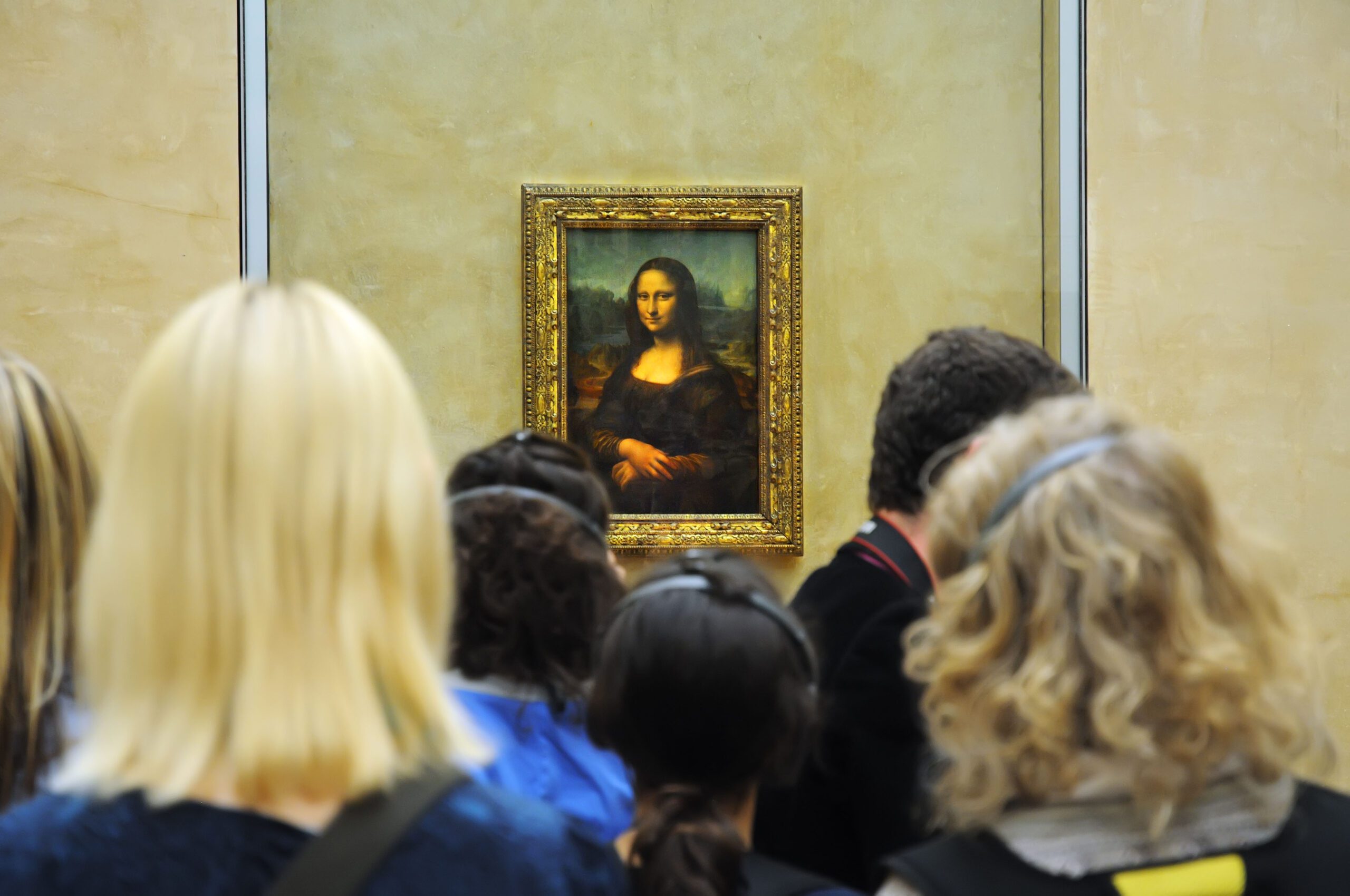 Tourists and the Mona Lisa in the Louvre Museum, Paris
